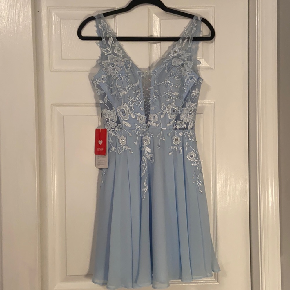 Jj’s house light blue dress.